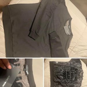 Women’s Black crew neck with mesh back side. Size L & arms fit like small.